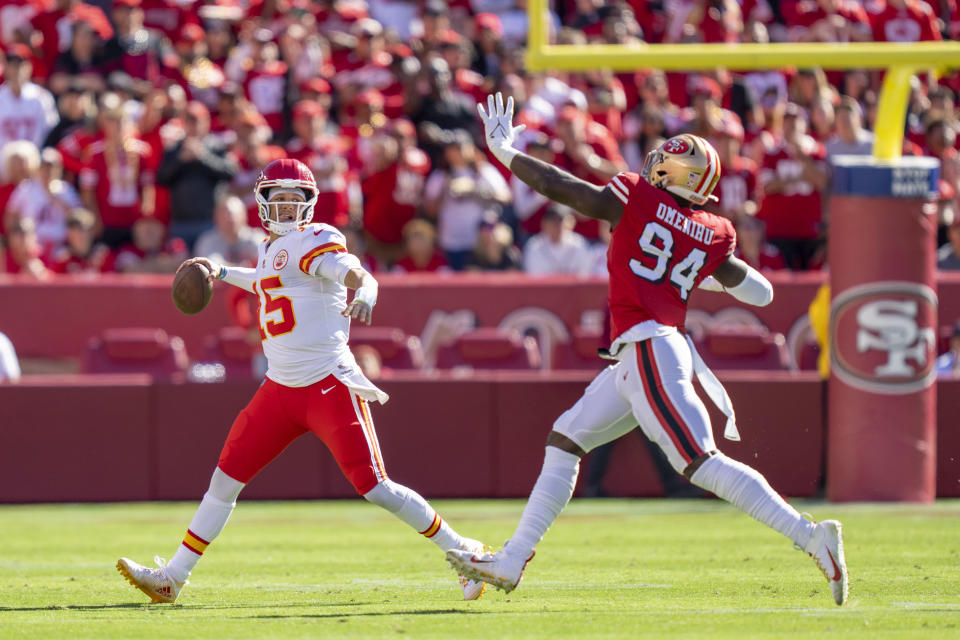 October 23, 2022; Santa Clara, California, USA; Kansas City Chiefs quarterback Patrick Mahomes (15) passes the football against San Francisco 49ers defensive end Charles Omenihu (94) during the second quarter at Levi’s Stadium. Mandatory Credit: Kyle Terada-USA TODAY Sports