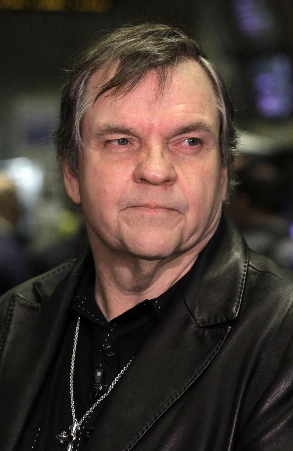 FILE - This June 21, 2010, file photo shows rock singer Meat Loaf on the floor of the New York Stock Exchange before ringing the opening bell. Meat Loaf, whose "Bat Out Of Hell" album is one of the all time bestsellers, has died, family said on Facebook, Friday, Jan. 21, 2022. (AP Photo/Richard Drew, File)