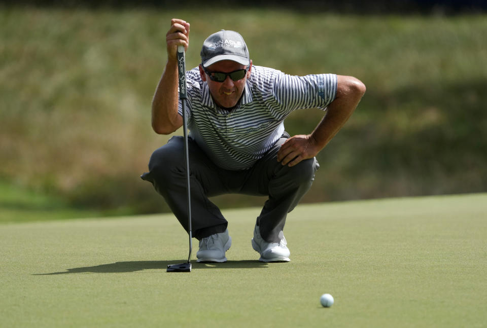 Cameron Percy (pictured) lines up a putt on the first green during the third round of the Wyndham Champions.