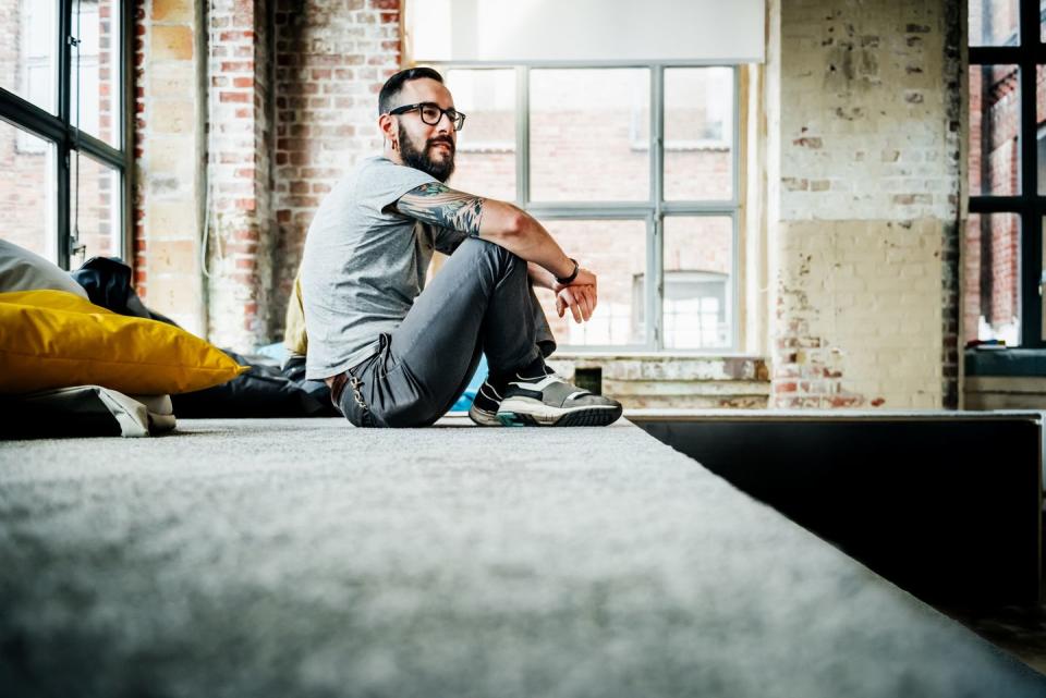 casual business person sitting in office loft