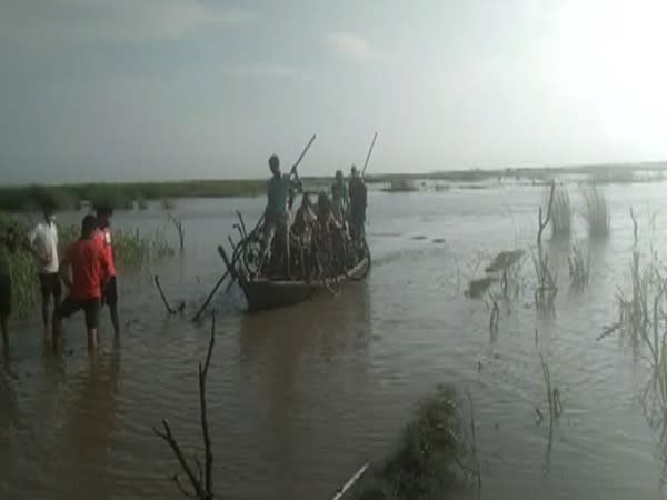 People being rescued after their boat got stuck in Gandak river, in Kushinagar on Friday. [Photo/ANI]