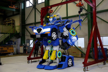 A new transforming robot called "J-deite RIDE" that transforms itself into a passenger vehicle, developed by Brave Robotics Inc, Asratec Corp and Sansei Technologies Inc, demonstrates during its unveiling at a factory near Tokyo, Japan, April 25, 2018. REUTERS/Toru Hanai