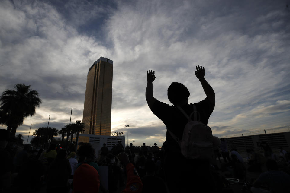 Protesters rally at the Trump Tower Monday, June 1, 2020, in Las Vegas, over the death of George Floyd. Floyd, a black man, died after being restrained by Minneapolis police officers on Memorial Day. (AP Photo/John Locher)