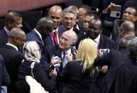 FIFA president Sepp Blatter is greeted by delegates after his re-election