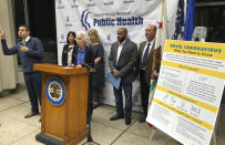 Dr. Sharon Balter, at podium with the Los Angeles County Department of Public Health officials, confirms a patient was taken to a hospital with Coronavirus symptoms at a news conference in Los Angeles Sunday, Jan. 26, 2020. The U.S. has several confirmed cases of the new virus from China, all among people who traveled to the city at the center of the outbreak, health officials said Sunday. (AP Photo/Chris Weber)