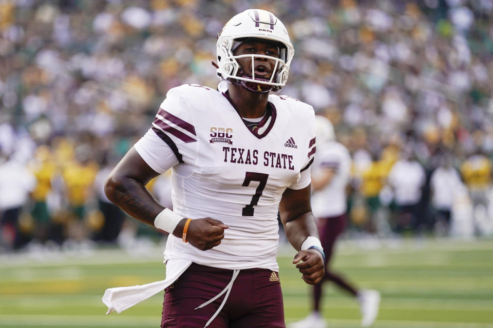 Texas State quarterback TJ Finley celebrates after a touchdown pass over Baylor in the first half of an NCAA college football game, Saturday, Sept. 2, 2023, in Waco, Texas. (Chris Jones/Waco Tribune-Herald, via AP)