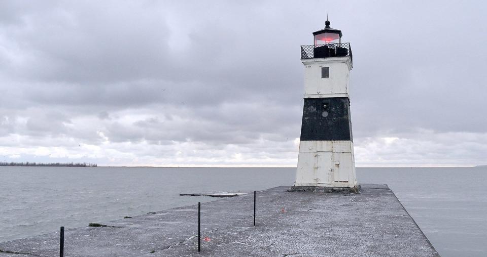 The North Pier Light at Presque Isle State Park features a red flashing light for mariners to navigate into Presque Isle Bay.