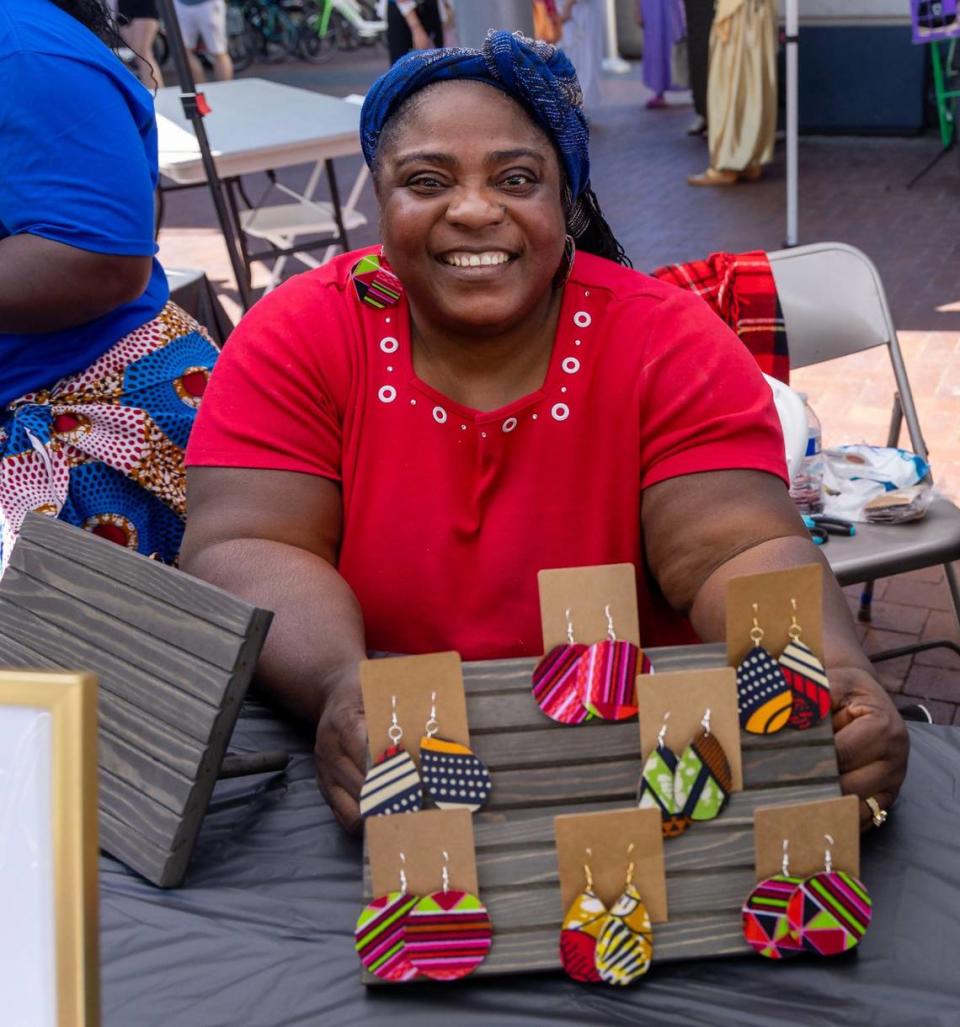 Rachel Julugbeh sold earrings to raise money to build a library in her native country of Liberia at a World Refugee Day celebration in downtown Boise.