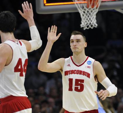 Sam Dekker (15) celebrates with Frank Kaminsky during Wisconsin's win over UNC on Thursday. (USAT)