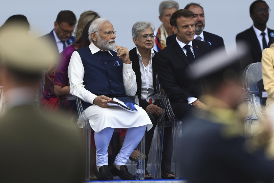 French President Emmanuel Macron and Indian Prime Minister Narendra Modi watch the Bastille Day military parade Friday, July 14, 2023 in Paris. India is the guest of honor at this year's Bastille Day parade, with Prime Minister Narendra Modi in the presidential tribune alongside French President Emmanuel Macron. (AP Photo/Aurelien Morissard)