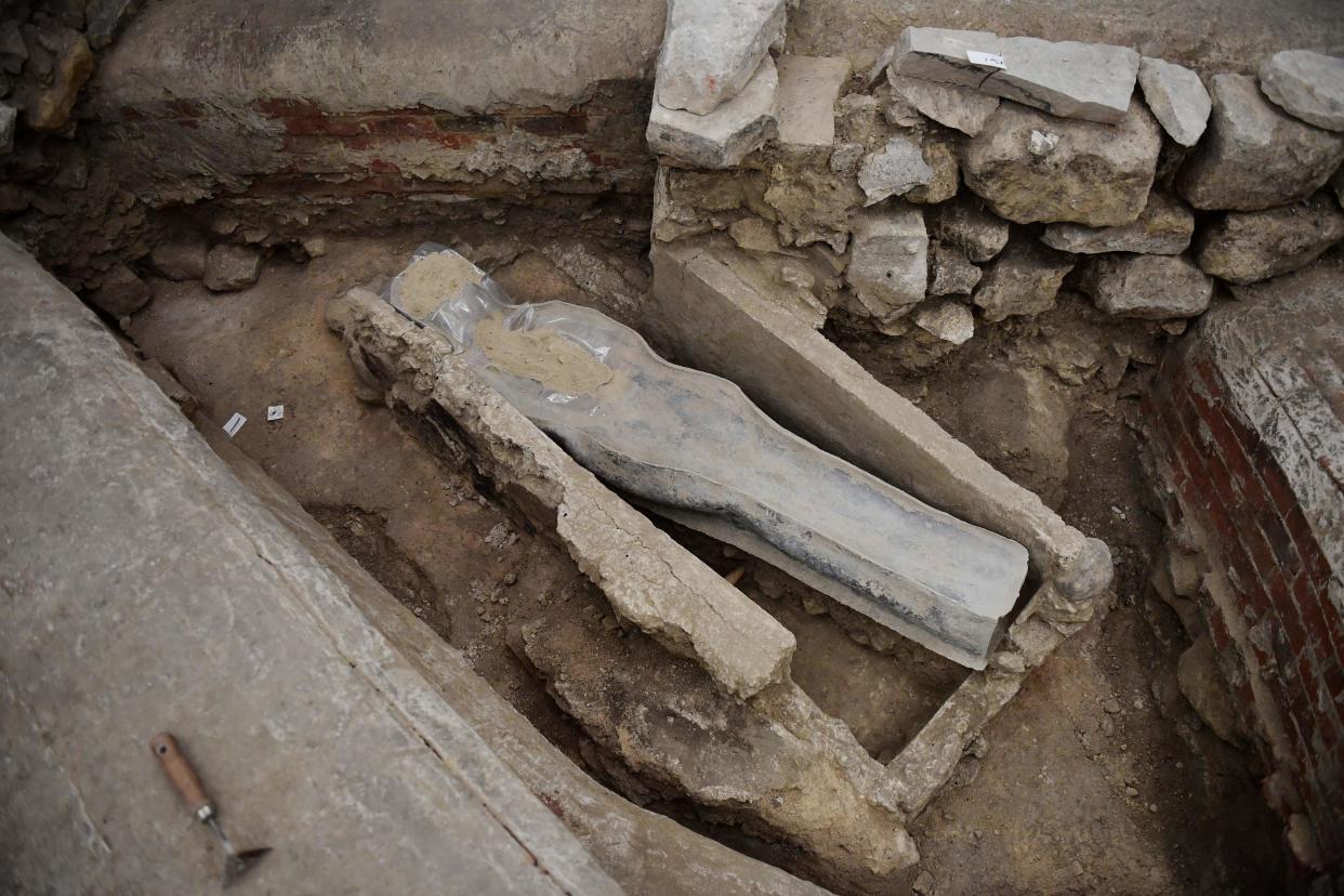 A picture shows a 14th century lead sarcophagus discovered in the floor of Notre Dame Cathedral, in Paris, on March 15, 2022. / AFP / JULIEN DE ROSA