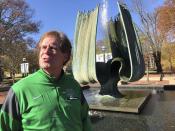 Marshall University athletic director Mike Hamrick speaks next to the Memorial Fountain on the school’s campus in Huntington, W.Va., Saturday, Nov. 7, 2020. The fountain is dedicated to the memory of 75 people killed in a Nov. 14, 1970, plane crash. Among the victims were 36 Marshall football players. (AP Photo/John Raby)