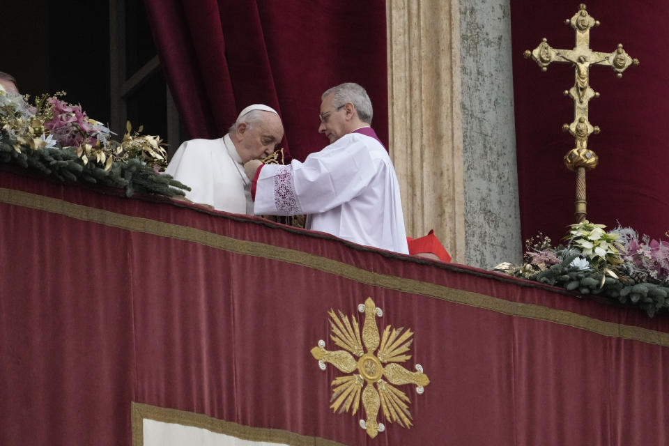 Pope Francis prepares to deliver the Urbi et Orbi (Latin for 'to the city and to the world' ) Christmas' day blessing from the main balcony of St. Peter's Basilica at the Vatican, Monday Dec. 25, 2023. (AP Photo/Gregorio Borgia)