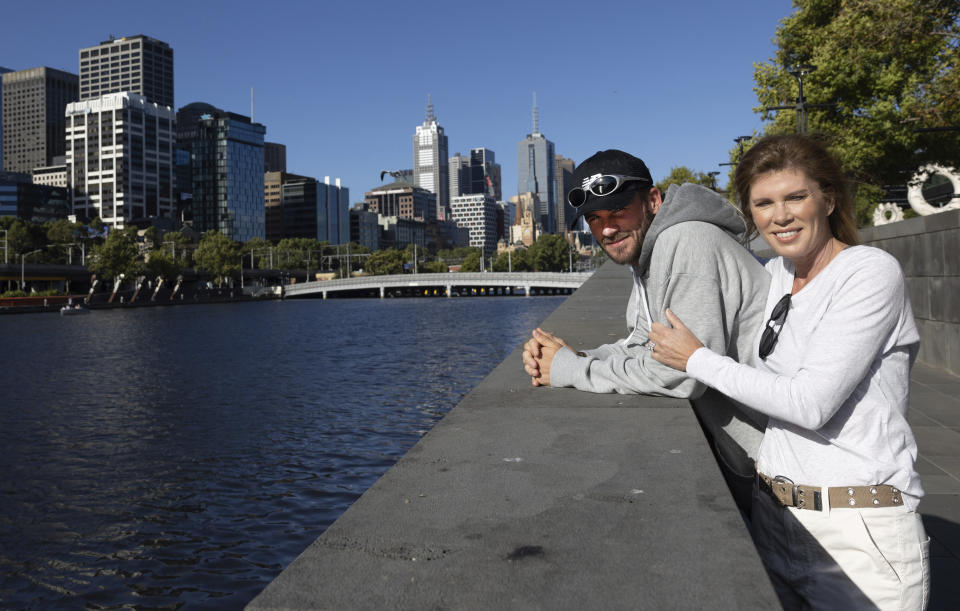 Tommy Paul of the U.S. walks with his mother Jill along the Yarra River in Melbourne, Australia, Thursday, Jan 26, 2023. Paul will play Novak Djokovic of Serbia in a semifinal at a the Australian Open, here Friday, Jan. 27. (Fiona Hamilton/Tennis Australia via AP)