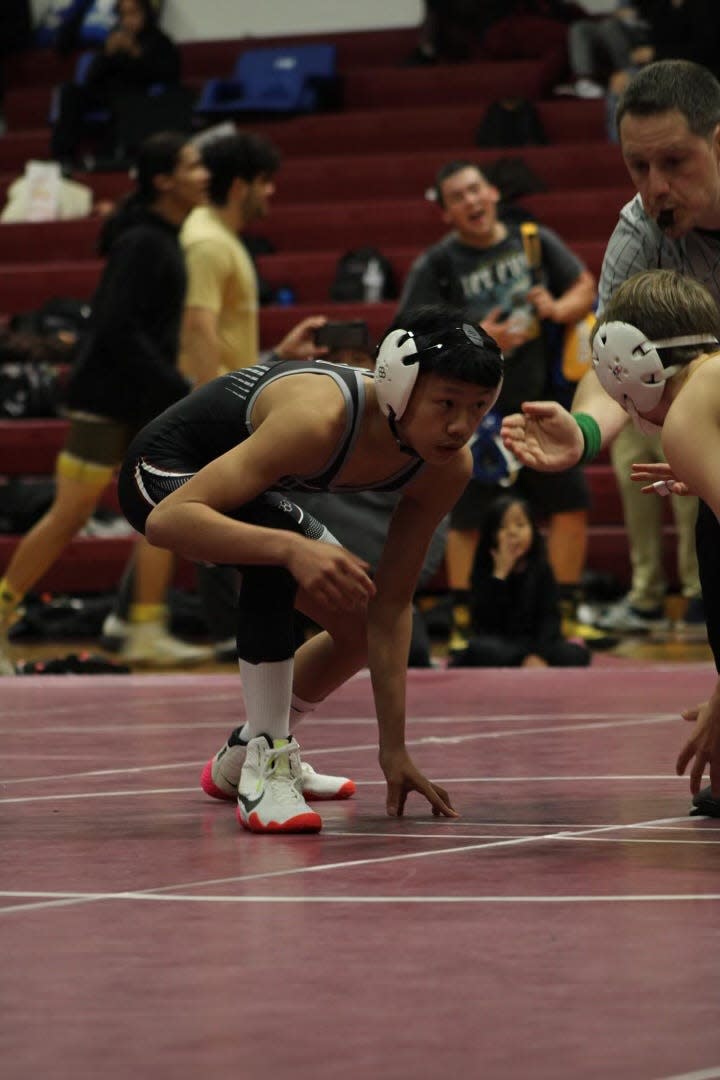 Weston Ranch's Maddox Lo crouches down to prepare for one of his wrestling matches during the 2023-24 season.