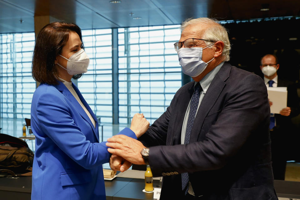 European Union foreign policy chief Josep Borrell, right, greets Belarusian opposition politician Sviatlana Tsikhanouskaya during a European Foreign Affairs Ministers meeting at the European Council building in Luxembourg, Monday, June 21, 2021. EU foreign ministers were set to approve Monday a new set of sanctions against scores of officials in Belarus and prepare a series of measures aimed at the country's economy. (Johanna Geron/Pool Photo via AP)