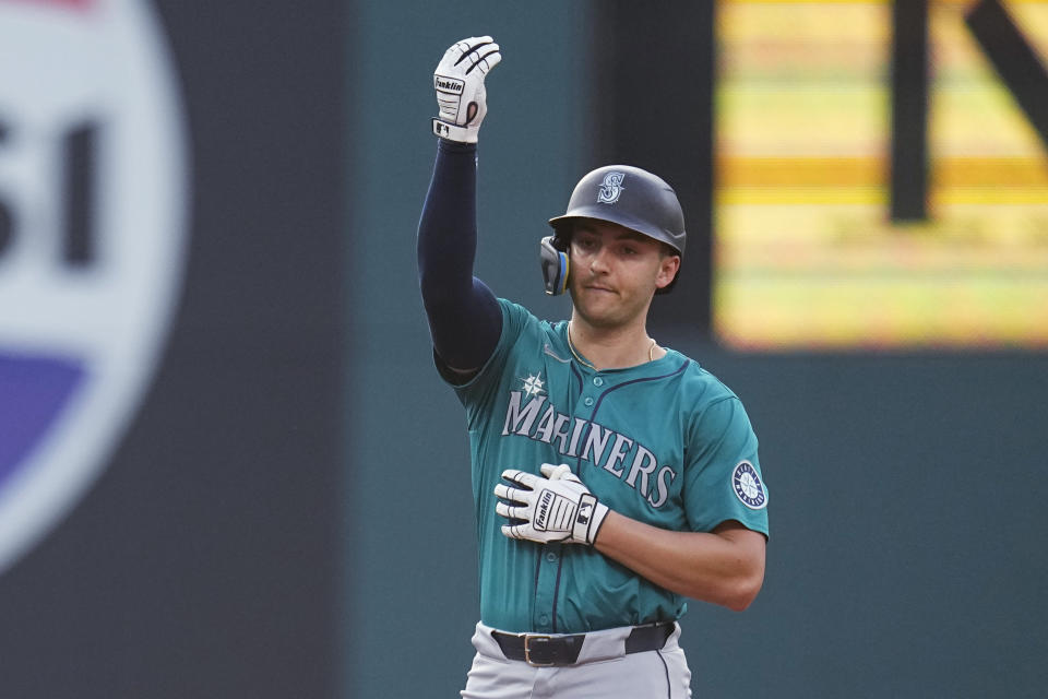 Seattle Mariners' Dominic Canzone gestures from second base after a double against the Cleveland Guardians during the fifth inning of a baseball game Wednesday, June 19, 2024, in Cleveland. (AP Photo/Sue Ogrocki)