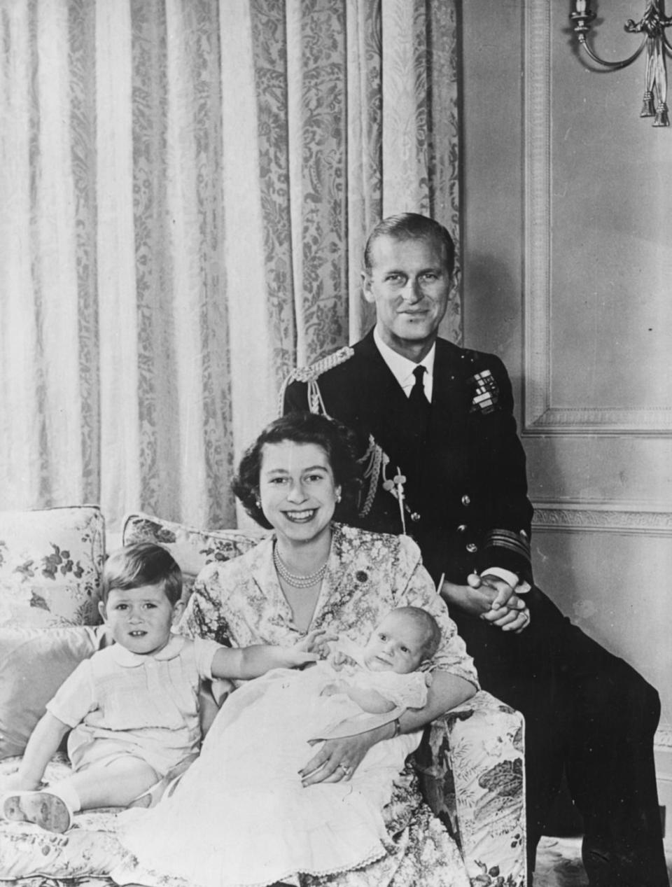 <p>Princess Anne, 2 months, poses for a photo with her brother, Prince Charles, 23 months, and their parents, Princess Elizabeth and Prince Philip, at Buckingham Palace. Elizabeth would become queen just two years later.</p>