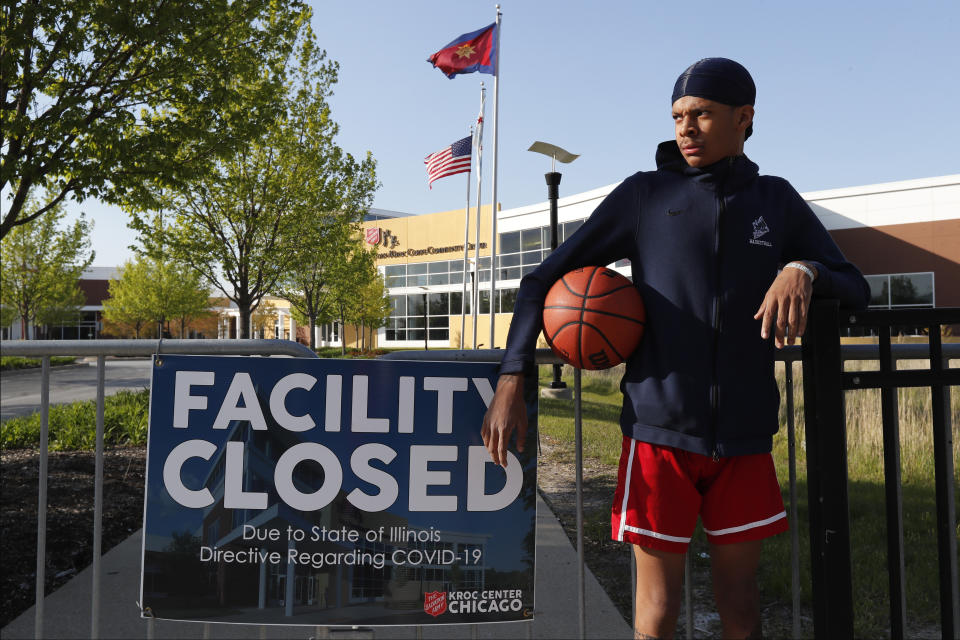 In this Tuesday, May 12, 2020, photo, Saint Wilkins poses for a portrait outside The Salvation Army's Ray and Joan Kroc Corps Community Center on Chicago's Southside. Growing up in a rough part of Chicago's South Side, Wilkins figured he was headed for a life on the streets. "If it wasn't for the Kroc Center, I'd be gang-banging," Wilkins said. "I promise you that." (AP Photo/Charles Rex Arbogast)