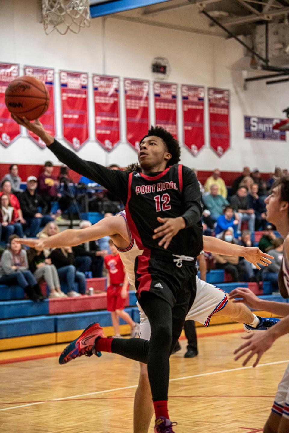 Port Huron’s Deonte Foy goes for a layup during a game last season. He finished with seven points in the Big Reds' 53-42 loss to Utica on Wednesday