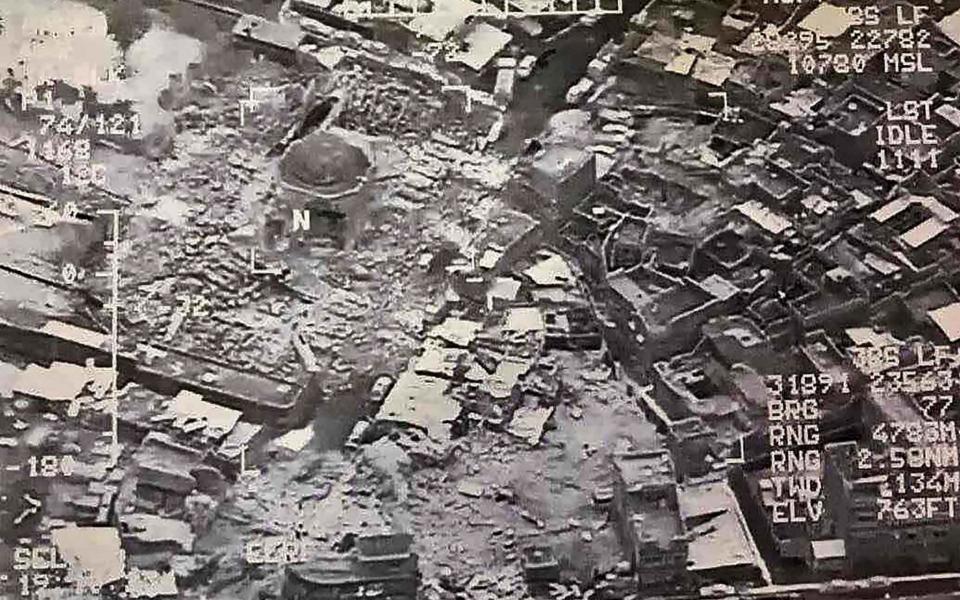 This aerial view taken on June 21, 2017 and provided by Iraq's Joint Operation Command reportedly shows destruction inside Mosul's Nuri mosque compound - Credit: AFP