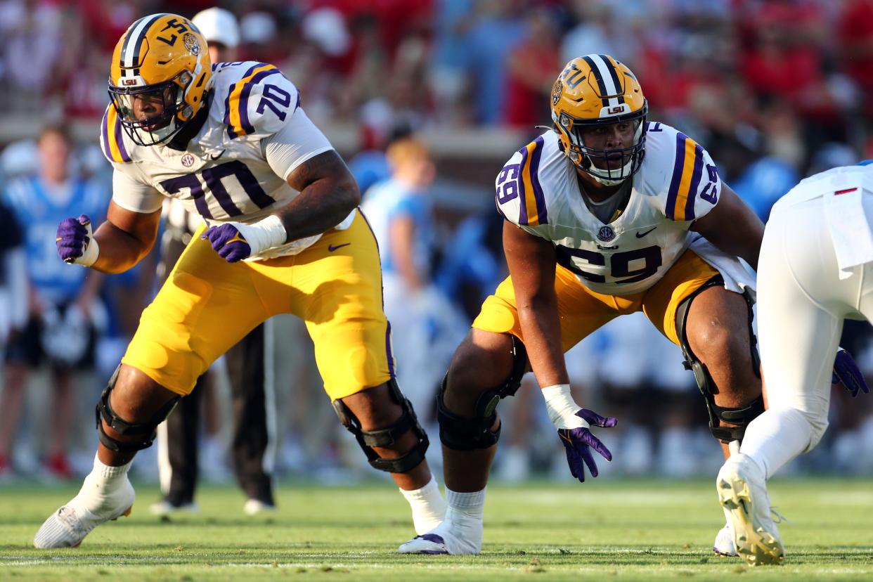 LSU center Charles Turner III (right) blocks alongside teammate  Miles Frazier (70) during the first half at Mississippi, Sept 30, 2023.
