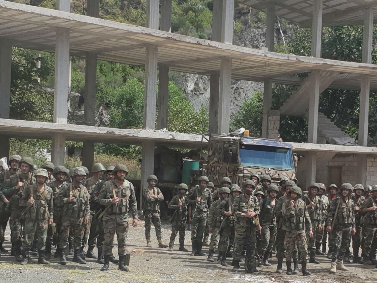 Syrian frontline troops stand at their base opposite Nusrah-held hills on the edge of Idlib province: Nelofer Pazira