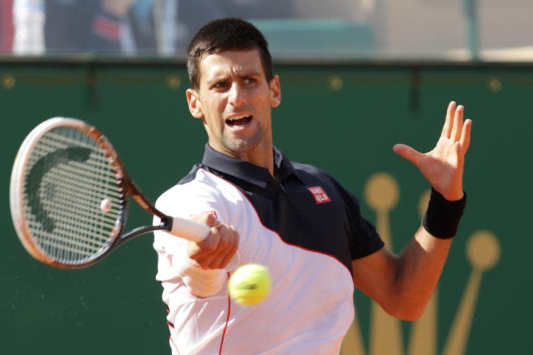 Serbia's Novak Djokovic returns the ball to Switzerland's Roger Federer during their Monte-Carlo ATP Masters Series Tournament in Monaco, on April 19, 2014