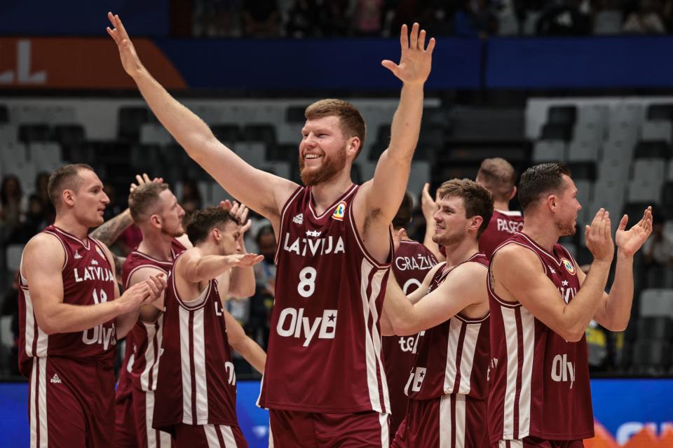 Latvia’s Davis Bertans and teammates celebrate after winning the FIBA Basketball World Cup group L match between Brazil and Latvia at Indonesia Arena in Jakarta on September 3, 2023. (Photo by Yasuyoshi CHIBA / AFP) (Photo by YASUYOSHI CHIBA/AFP via Getty Images)