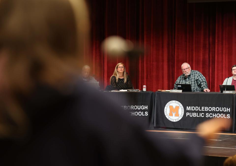 A person speaks as Middleboro Superintendent of Public Schools Carolyn Lyons and School Committee chairman Richard Young listen during a meeting at the high school auditorium on Thursday, May 18, 2023. 