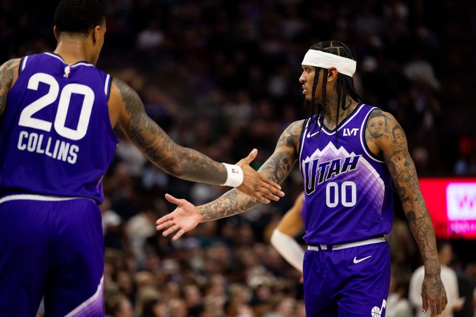 Utah Jazz forward John Collins (20) high-fives Utah Jazz guard Jordan Clarkson (00) during an NBA basketball game between the Utah Jazz and the Oklahoma City Thunder at the Delta Center in Salt Lake City on Tuesday, Feb. 6, 2024. | Megan Nielsen, Deseret News