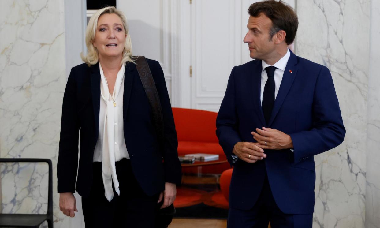 <span>French President Macron with National Rally leader Marine Le Pen, whose party could win big at the snap election.</span><span>Photograph: Ludovic Marin/AP</span>