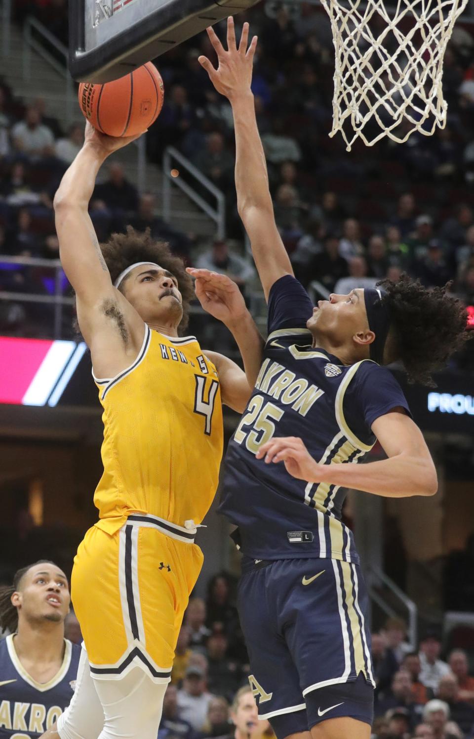 Kent State's Chris Payton puts up a shot as Akron's Enrique Freeman defends in a MAC quarterfinal March 10, 2023, in Cleveland.