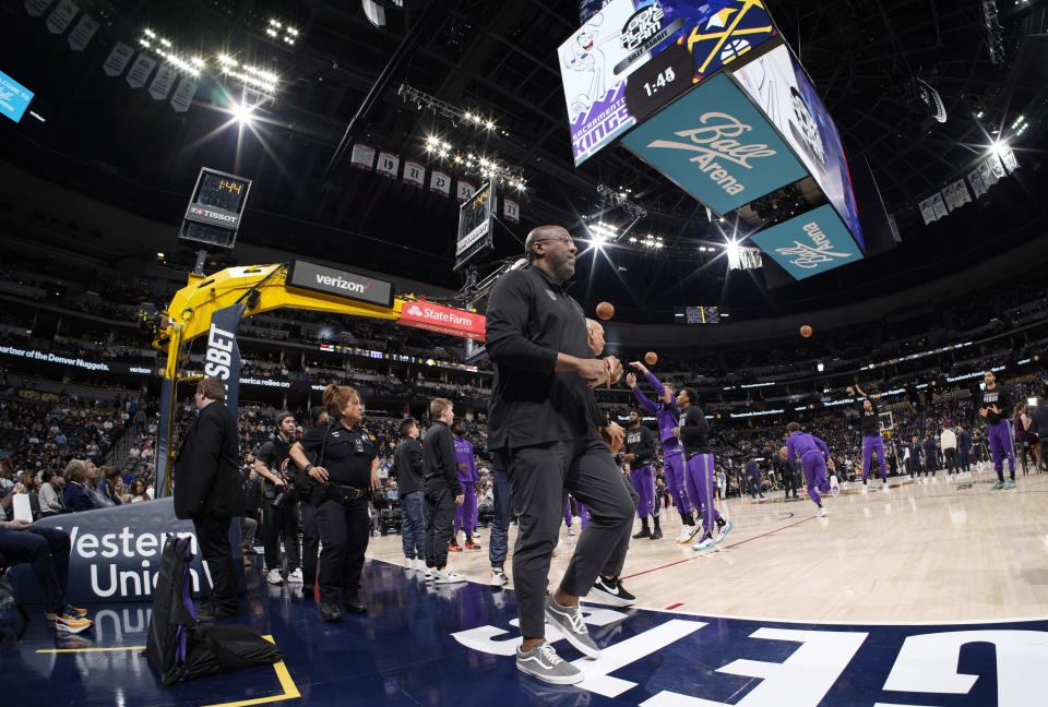 Sacramento Kings head coach Mike Brown heads to the bench for the first half of an NBA basketball game against the Denver Nuggets, Sunday, April 9, 2023, in Denver. (AP Photo/David Zalubowski)