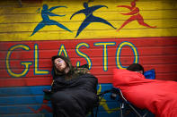 <p>Revellers sleep in front of a food stand at Worthy Farm in Somerset during the Glastonbury Festival, in Britain June 22, 2017. (Photo: Dylan Martinez/Reuters) </p>