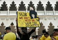 A protestor holds a placard demanding Malaysian Prime Minister Najib Razaks resignation during an anti-government rally in Kuala Lumpur on August 29, 2015