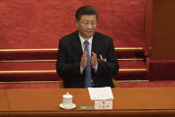 Chinese President Xi Jinping applauds during the second plenary session of China's National People's Congress (NPC) at the Great Hall of the People in Beijing, Monday, May 25, 2020. (Roman Pilipey/Pool Photo via AP)