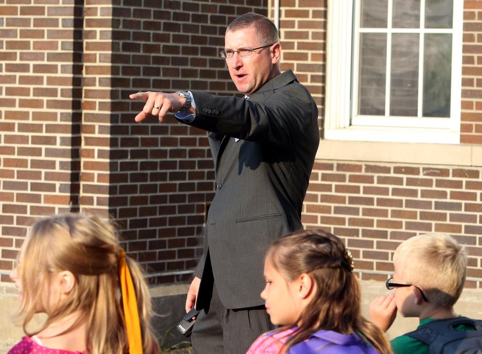 LaSalle Elementary School Principal Theodore Stevens points and speaks to students on the first day of classes for  Mishawaka schools in this 2013 file photo. SBT Photo/GREG SWIERCZ