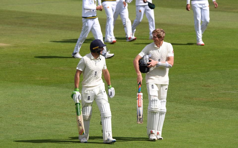 Jos Buttler and Zak Crawley of England walk off at lunch during Day Two of the 3rd #RaiseTheBat Test Match between England and Pakistan at the Ageas Bowl on August 22, 2020 in Southampton, England.  - GETTY IMAGES