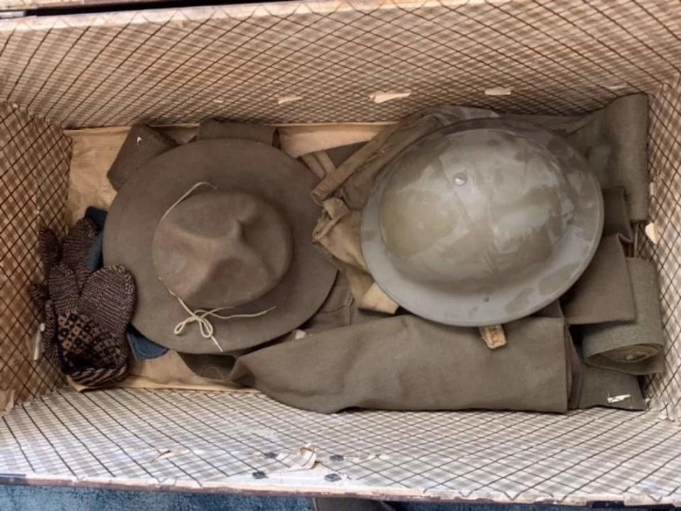 A trunk discovered at a family home in Grand Falls-Windsor contained several artifacts from the First World War, including a helmet, hat, uniform, mitts, documents and bullets. (The Rooms - image credit)