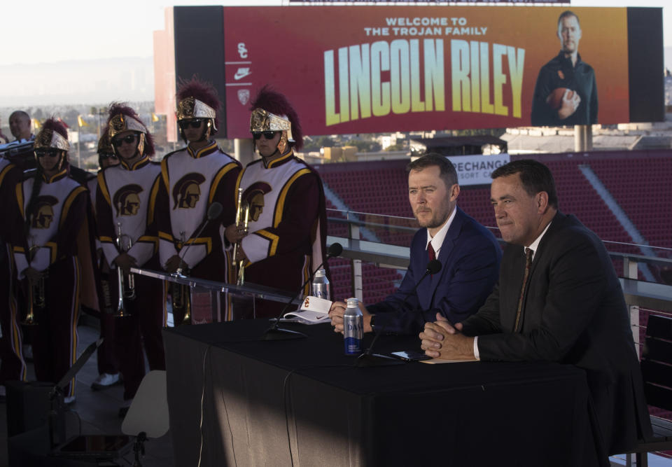 USC head football coach Lincoln Riley, left, and USC Athletic Director Mike Bohn, right, during a press conference at the Coliseum on Monday, Nov. 29, 2021 in Los Angeles. (Brian van der Brug / Los Angeles Times)