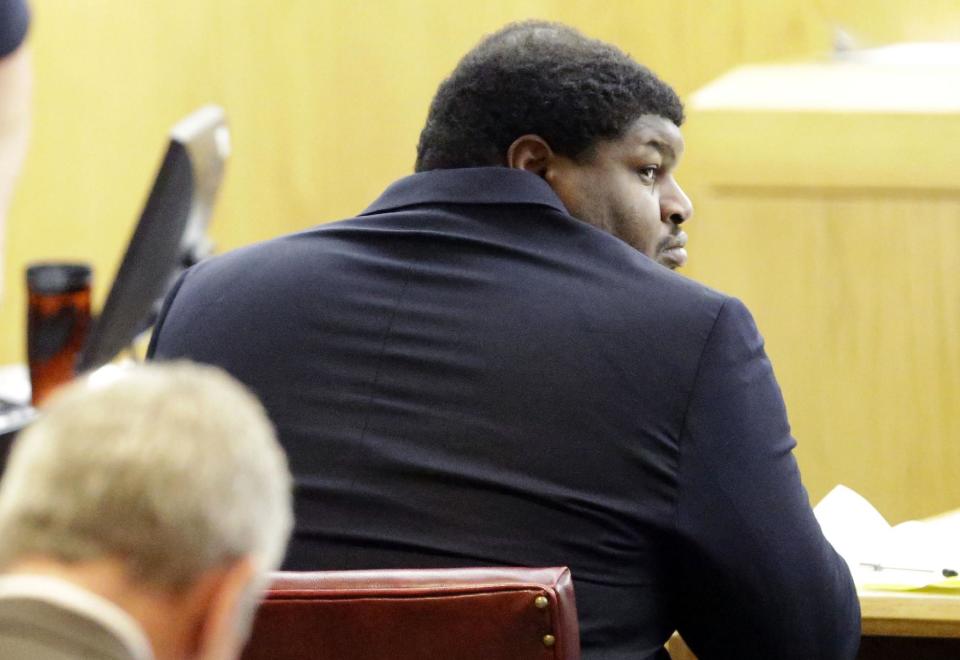 Former Dallas Cowboys Josh Brent looks around in court during the penalty phase of the intoxication manslaughter trial in Dallas, Thursday, Jan. 23, 2014. Brent was found guilty on Wednesday, of intoxication manslaughter and faces probation to 20 years for a fiery wreck that killed his teammate and close friend Jerry Brown. (AP Photo/LM Otero)