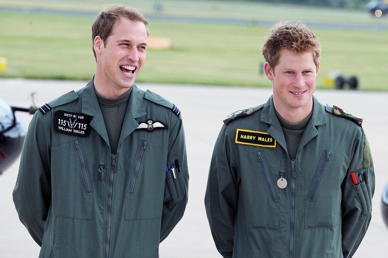 Prince William and Prince Harry attend a photocall during his military helecopter training course at RAF Shawbury on June 18, 2009 in Shawbury, England.