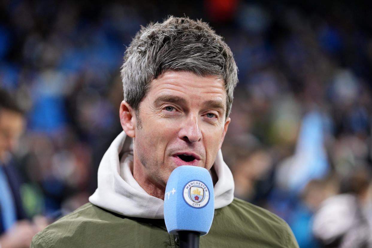 MANCHESTER, ENGLAND - NOVEMBER 24: Singer-songwriter, Noel Gallagher is interviewed pitch side prior to the UEFA Champions League group A match between Manchester City and Paris Saint-Germain at Etihad Stadium on November 24, 2021 in Manchester, England. (Photo by Matt McNulty - Manchester City/Manchester City FC via Getty Images)