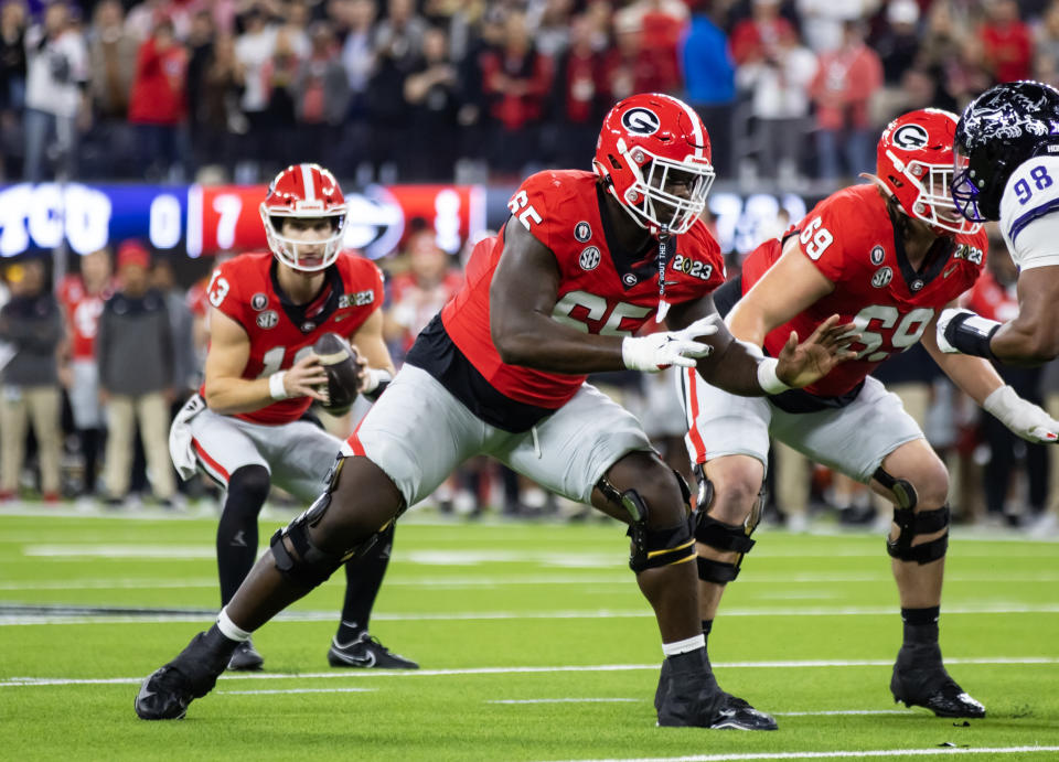 Jan 9, 2023; Inglewood, CA, USA; Georgia Bulldogs offensive lineman Amarius Mims (65) against the TCU Horned Frogs during the CFP national championship game at SoFi Stadium. Mandatory Credit: Mark J. Rebilas-USA TODAY Sports