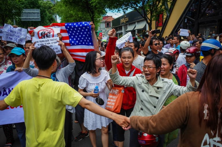 Protesters shout slogans against the land lease proposal earlier this month