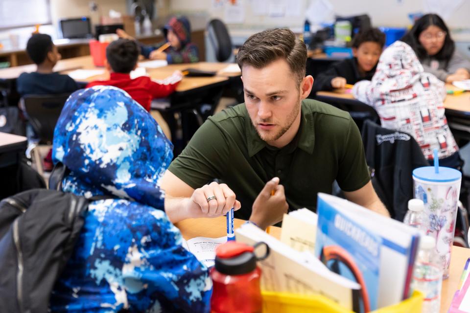 Fourth-grade teacher Rodney LaFleur quizzes his students on phonics skills at Nystrom Elementary in Richmond, Calif.