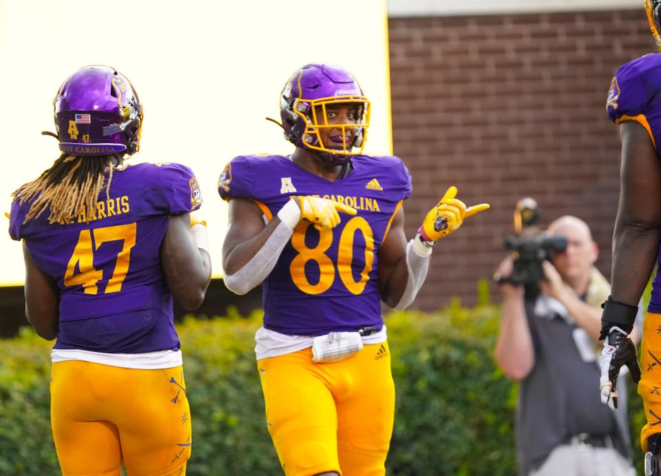 Sep 3, 2022; Greenville, North Carolina, USA; East Carolina Pirates tight end Shane Calhoun (80) celebrates his touchdown catch against the North Carolina State Wolfpack during the second half at Dowdy-Ficklen Stadium.