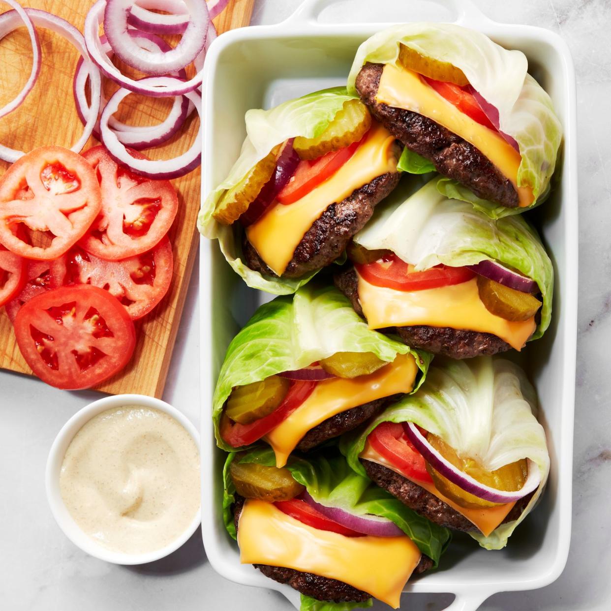 cheesburger with tomato wrapped inside cabbage