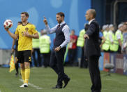 <p>England head coach Gareth Southgate, center, talks to his players as Belgium’s Jan Vertonghen prepares for a throw-in during the third place match between England and Belgium at the 2018 soccer World Cup in the St. Petersburg Stadium in St. Petersburg, Russia, Saturday, July 14, 2018. (AP Photo/Petr David Josek) </p>